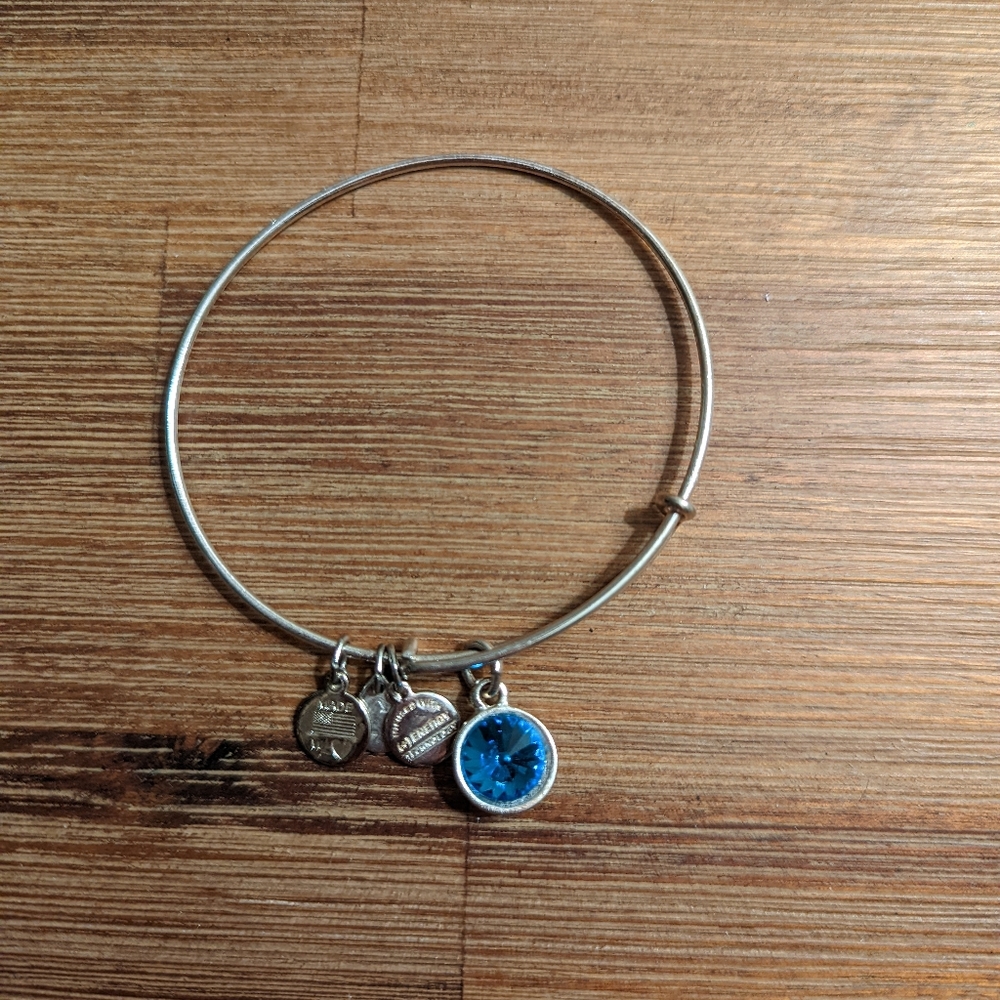 Alex and Ani adjustable bangle with blue topaz stone